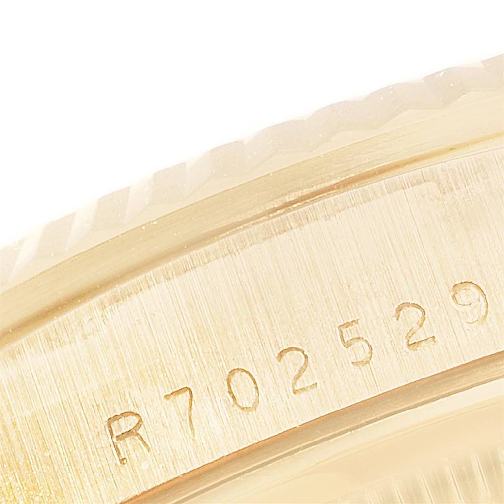 The image shows a close-up of the serial number engraved on the side of a Rolex President 18238 Men
s Yellow Gold Champagne Dial 18238 Men
s Yellow Gold Champagne Dial model watch.