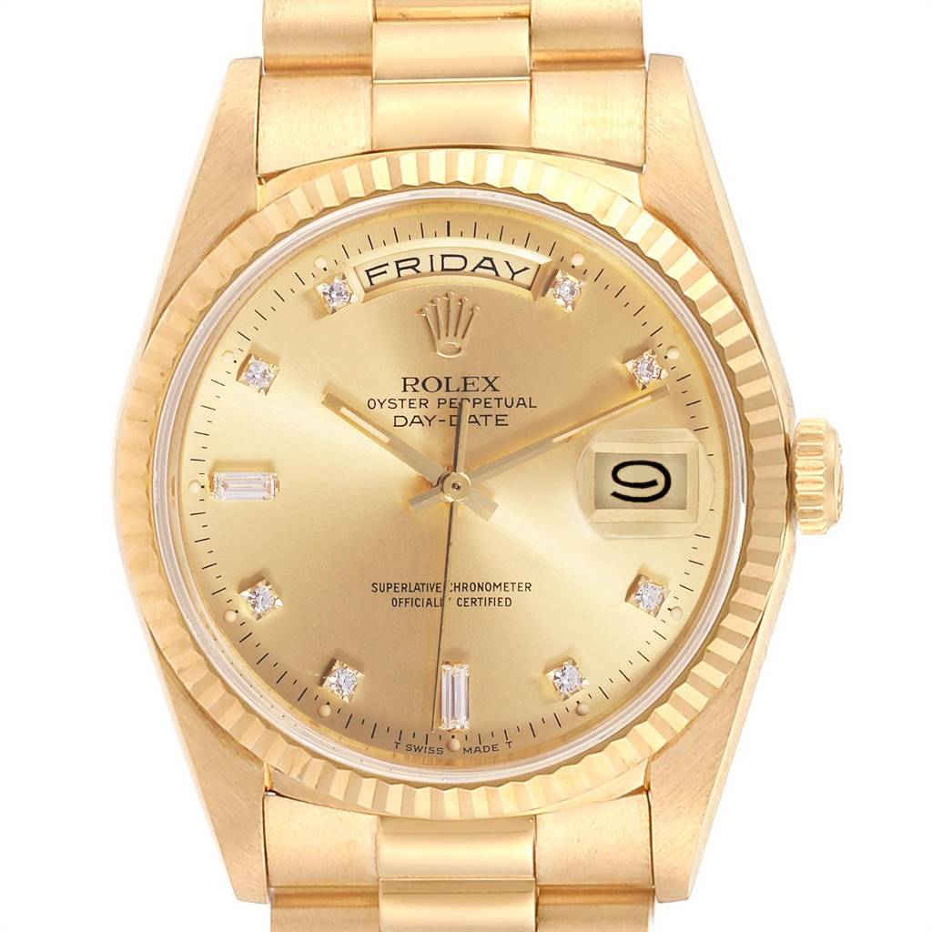 This image shows the face and partial bracelet of a Rolex President 18238 Men
s Yellow Gold Champagne Dial 18238 Men
s Yellow Gold Champagne Dial model watch, highlighting the day and date display and golden details.