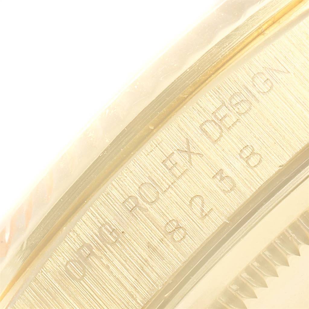This close-up image shows the engraved markings on the case side of a Rolex President 18238 Men
s Yellow Gold Black Dial 18238 Men
s Yellow Gold Black Dial model watch.