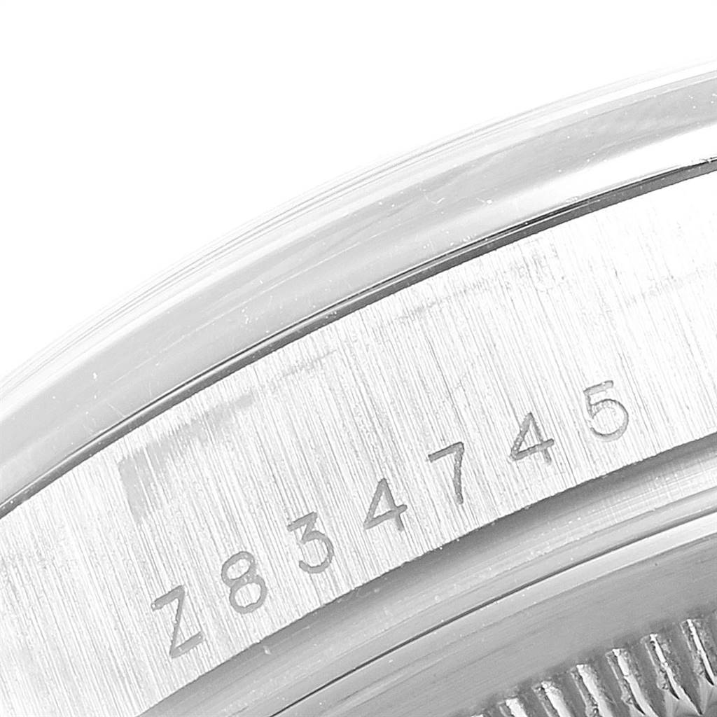 This is a close-up angle of the serial number on the case of a Rolex President 118296 Men's Platinum Silver Dial 118296 Men's Platinum Silver Dial model watch.