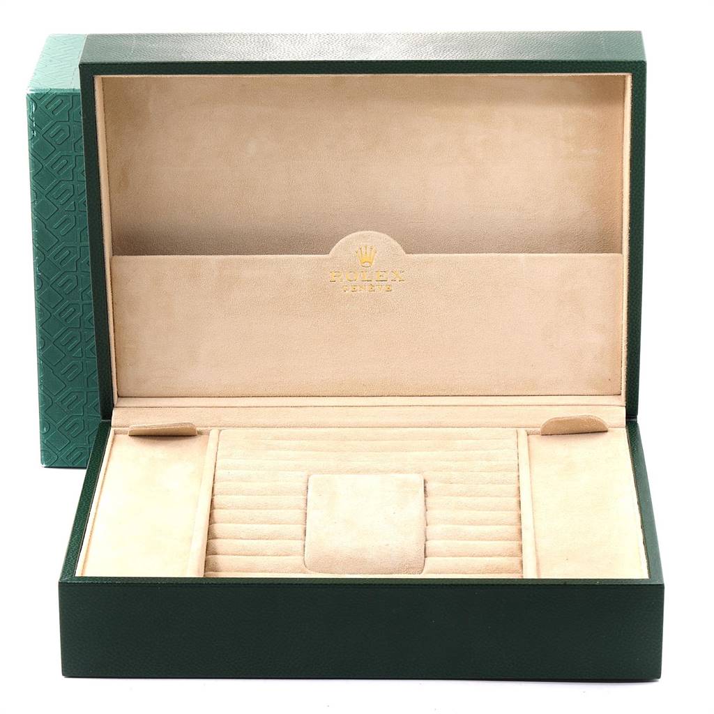 The image shows an open Rolex President 118296 Men's Platinum Silver Dial 118296 Men's Platinum Silver Dial model watch box, featuring a suede-lined interior and a space for the watch.