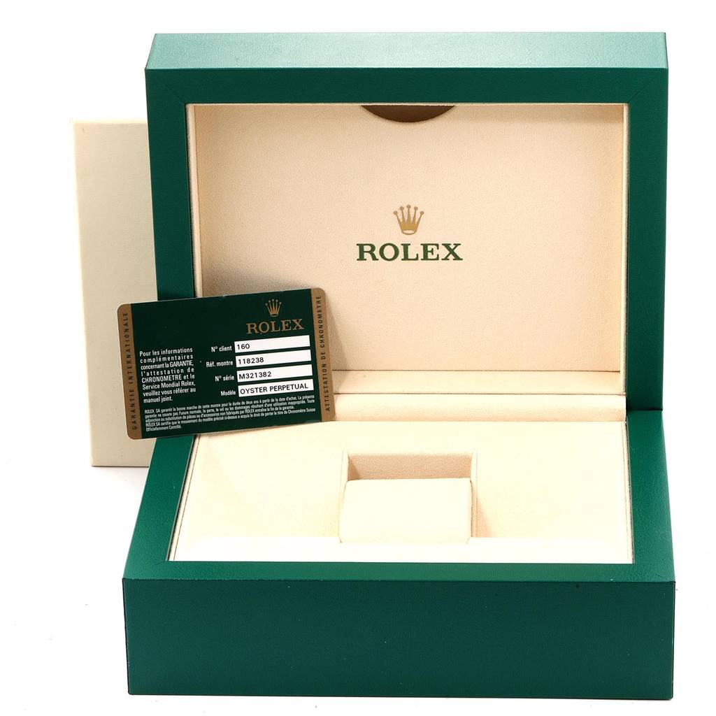The image shows an open green and cream Rolex watch box with a guarantee card for the Rolex President 118238 Men
s Yellow Gold Champagne Dial 118238 Men
s Yellow Gold Champagne Dial model.