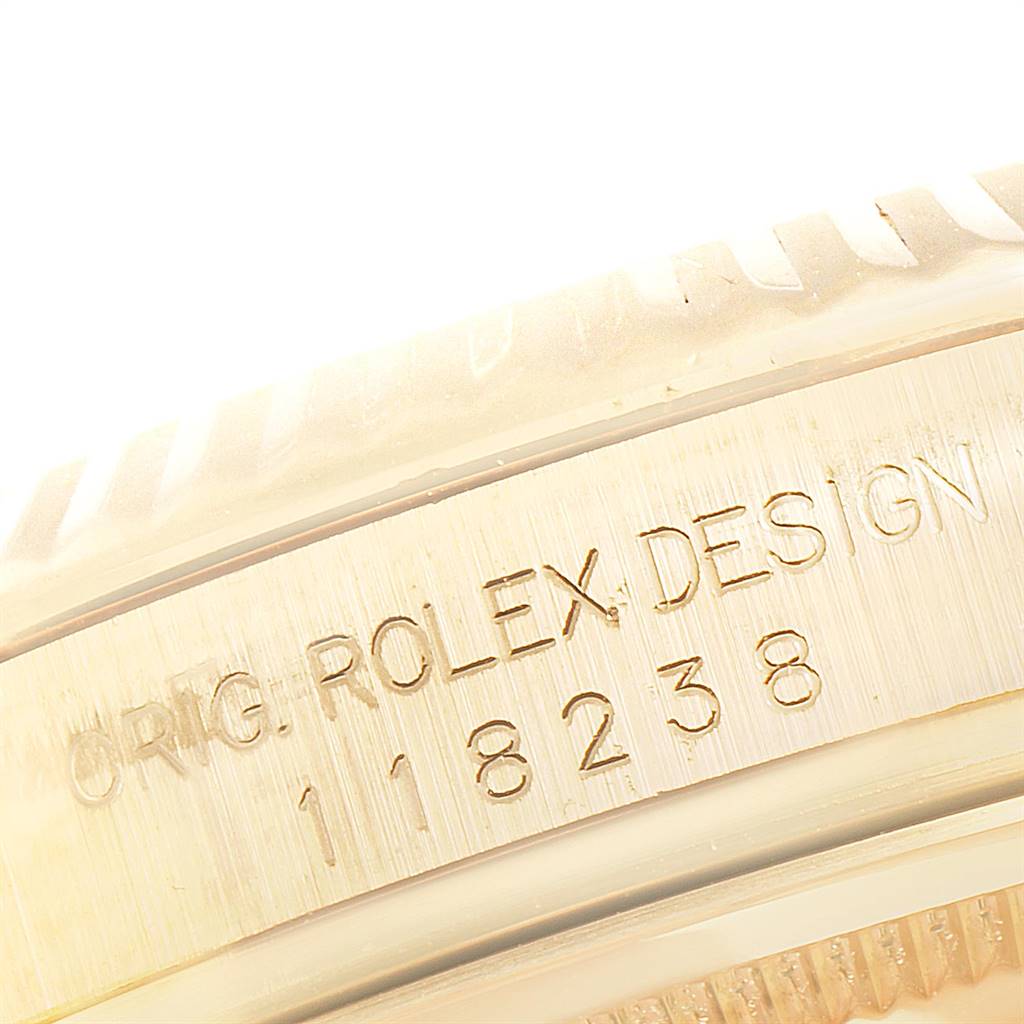 This image shows a close-up of the engraved side case of a Rolex President 118238 Men
s Yellow Gold Champagne Dial 118238 Men
s Yellow Gold Champagne Dial model watch, showcasing the serial and model number.