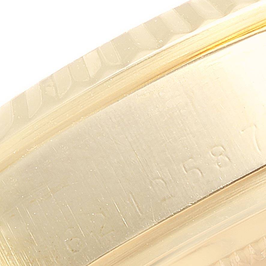 This is a close-up image showing the side of a Rolex President 18038 Men
s Yellow Gold Champagne Dial 18038 Men
s Yellow Gold Champagne Dial model watch, focusing on the engraved serial number.