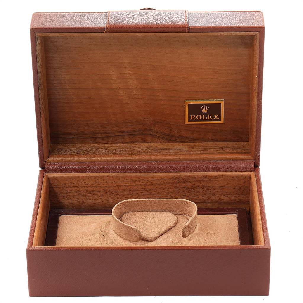 The image shows an open Rolex President 18038 Men
s Yellow Gold Champagne Dial 18038 Men
s Yellow Gold Champagne Dial model watch box, revealing a suede watch holder and the Rolex logo inside.