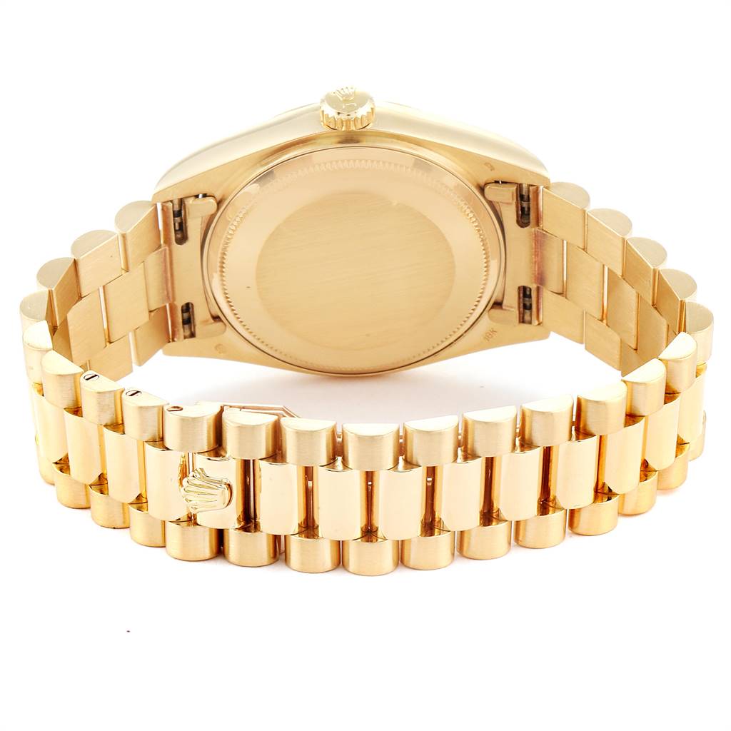 This image shows the back view of a Rolex President 18038 Men
s Yellow Gold Champagne Dial 18038 Men
s Yellow Gold Champagne Dial model watch, highlighting the case back and the gold link bracelet.