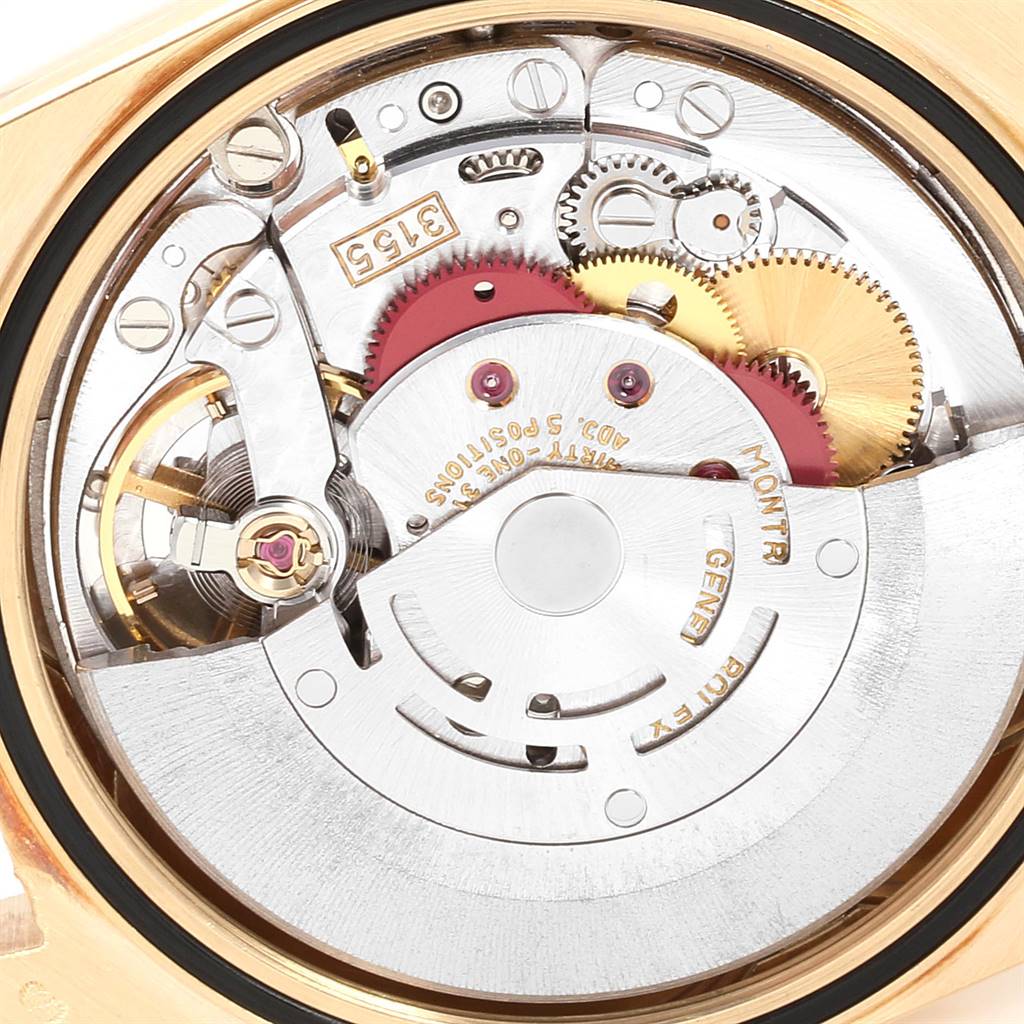 The image shows a close-up of the movement mechanism of a Rolex President 18238 Men's Yellow Gold Champagne Dial 18238 Men's Yellow Gold Champagne Dial model watch, highlighting its intricate gears and components.
