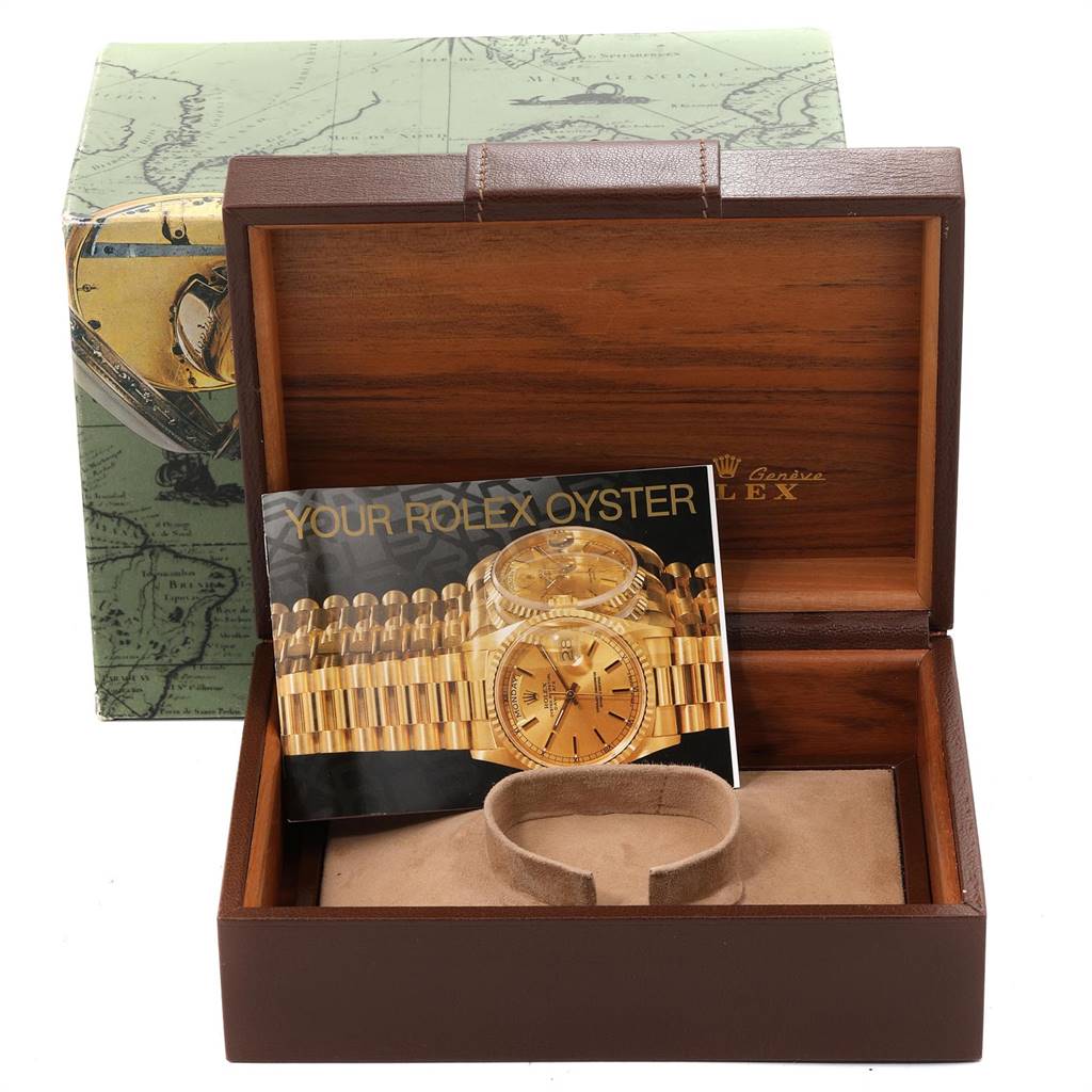 The image shows a Rolex President 18238 Men's Yellow Gold Champagne Dial 18238 Men's Yellow Gold Champagne Dial watch box at an angle, featuring the inner lining and accompanying booklet.