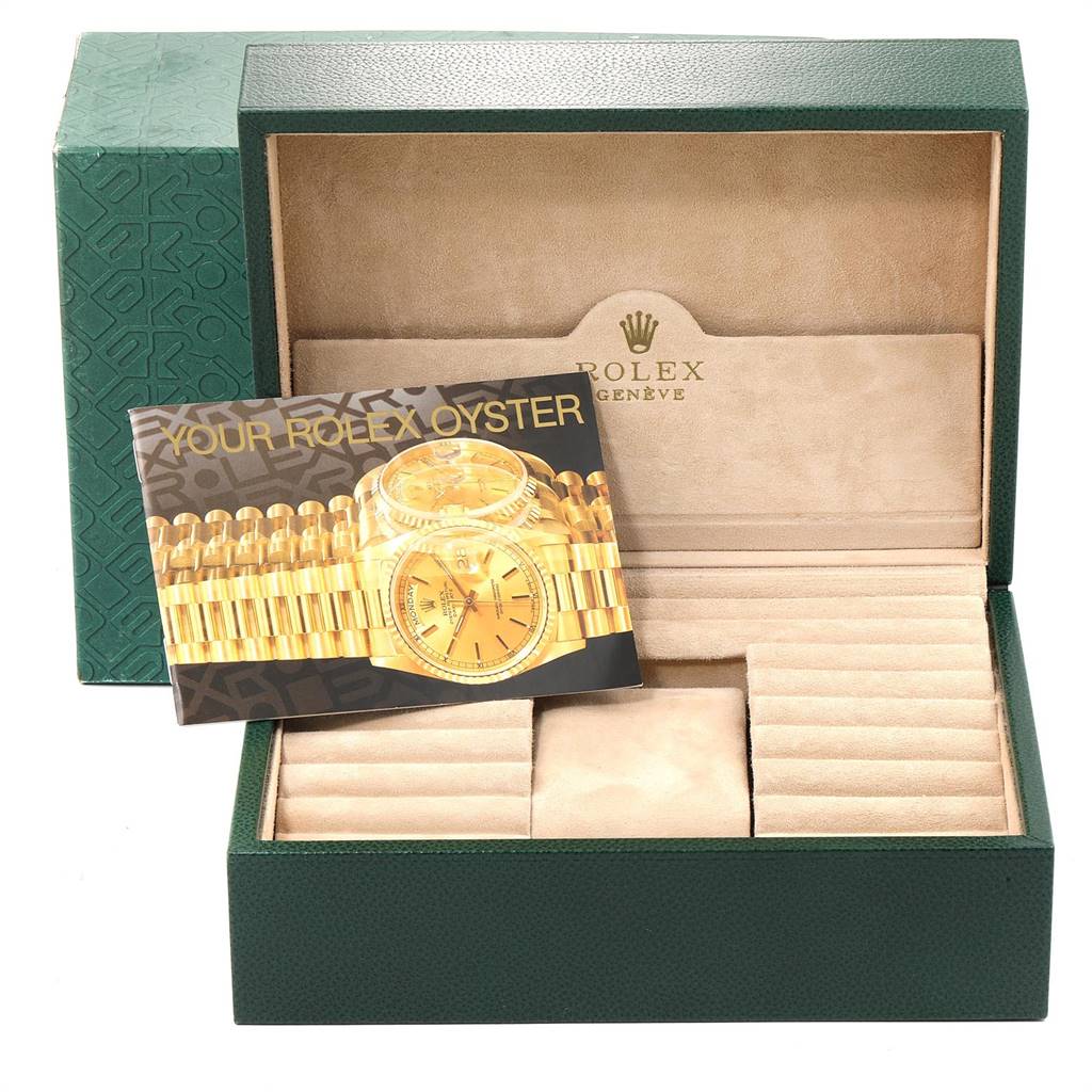 The image shows a Rolex President 18238 Men
s Yellow Gold Mother of Pearl Dial 18238 Men
s Yellow Gold Mother of Pearl Dial model watch box open, revealing slots for watches and an instruction booklet.