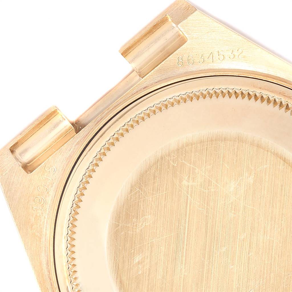 The image shows a close-up of the back case and lugs of a Rolex President 19018 Men
s Yellow Gold Black Dial 19018 Men
s Yellow Gold Black Dial model watch.