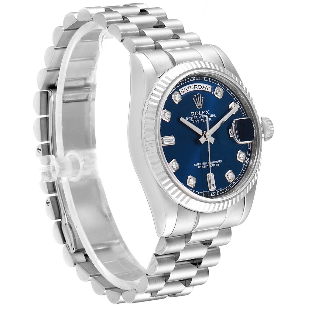 The image shows a side perspective of a Rolex President 118239 Men's White Gold Blue Dial 118239 Men's White Gold Blue Dial watch, displaying its band, crown, and blue dial face.