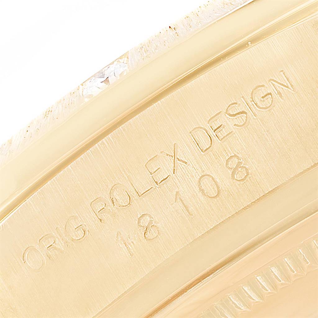 The image shows a close-up of the bezel and case of the Rolex President 18108 Men
s Yellow Gold Brown Dial 18108 Men
s Yellow Gold Brown Dial model, displaying the engraved model number.