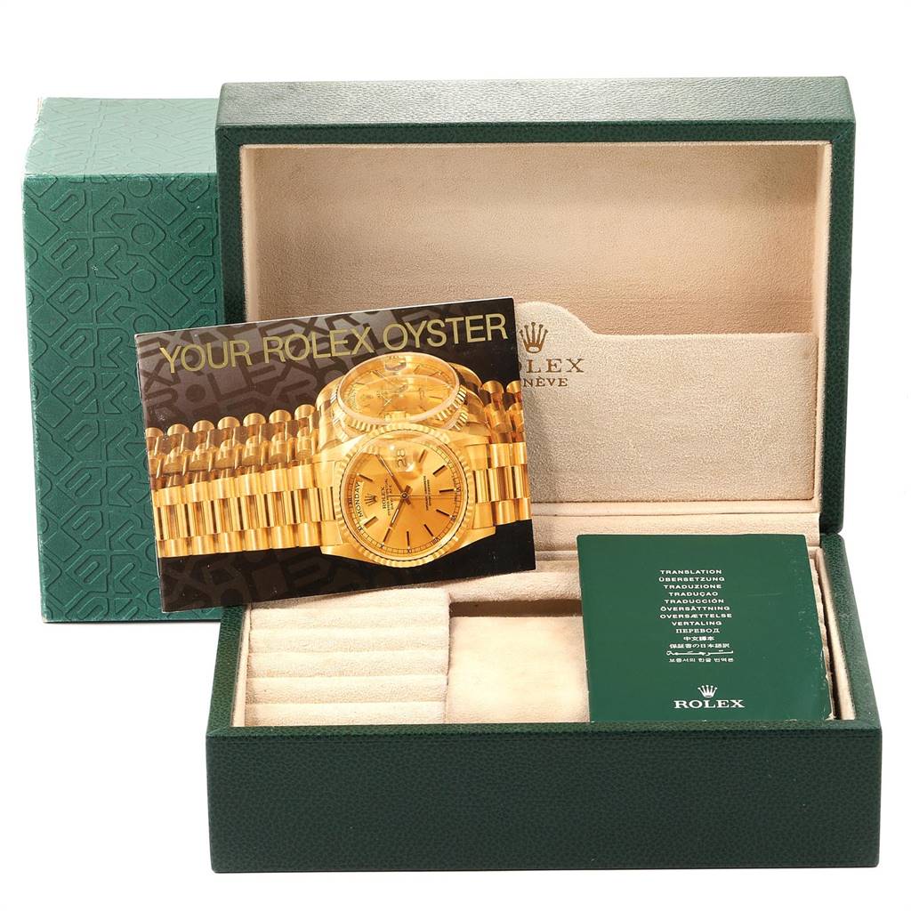This image shows a Rolex President 18108 Men
s Yellow Gold Brown Dial 18108 Men
s Yellow Gold Brown Dial model watch box with the cover and instruction manual placed inside.