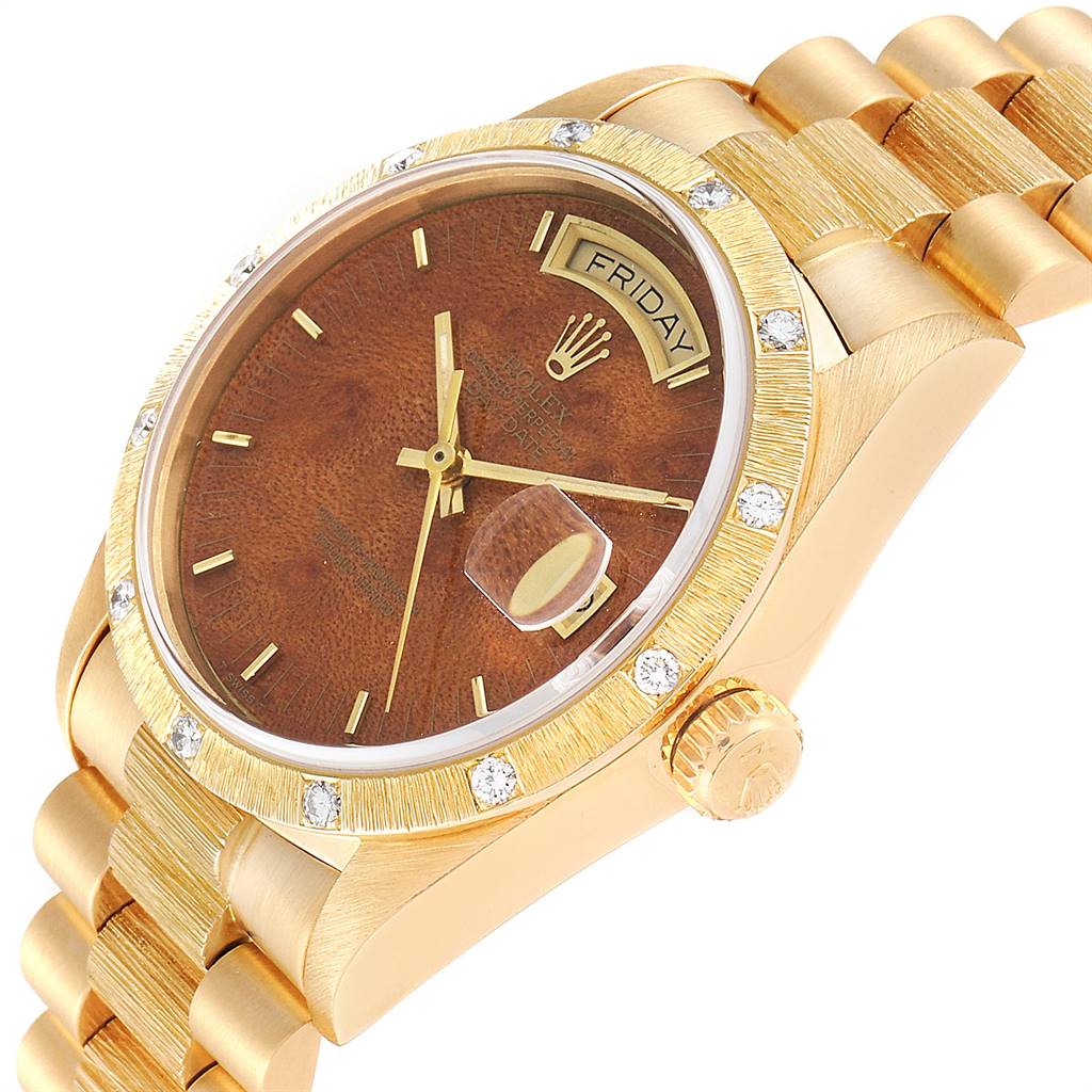 The image shows an angled view of a Rolex President 18108 Men
s Yellow Gold Brown Dial 18108 Men
s Yellow Gold Brown Dial watch featuring its dial, bezel, bracelet, and crown.