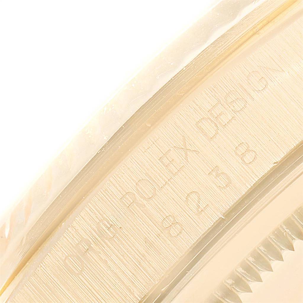 This close-up shows the engraved inner bezel of a Rolex President 18238 Men
s Yellow Gold Champagne Dial 18238 Men
s Yellow Gold Champagne Dial model watch.