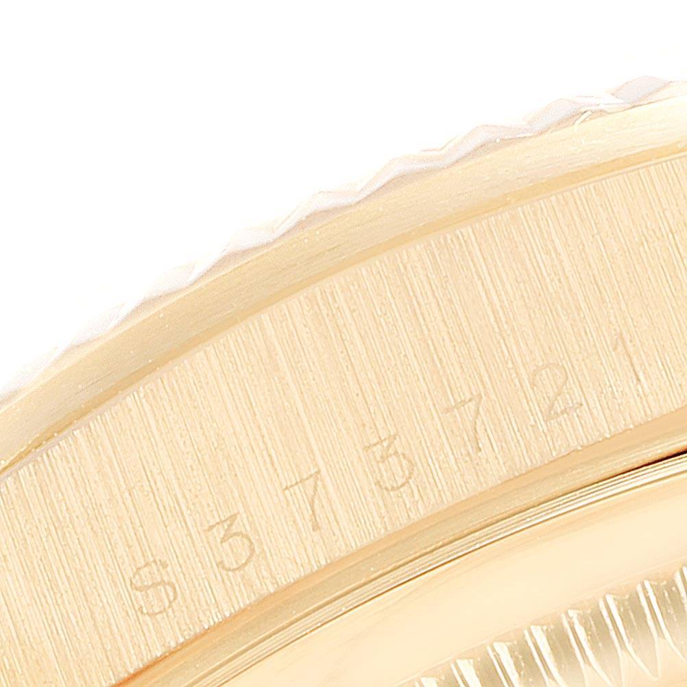The image shows a close-up view of the bezel and engraved serial number of the Rolex President 18238 Men
s Yellow Gold Champagne Dial 18238 Men
s Yellow Gold Champagne Dial model watch.