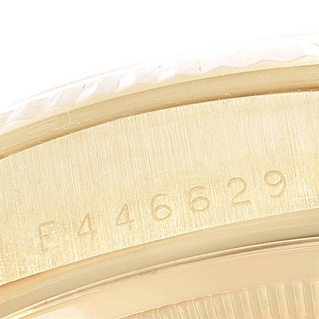 This image shows a close-up of the serial number engraved on the side of a Rolex President 18238 Men
s Yellow Gold Champagne Dial 18238 Men
s Yellow Gold Champagne Dial model watch.