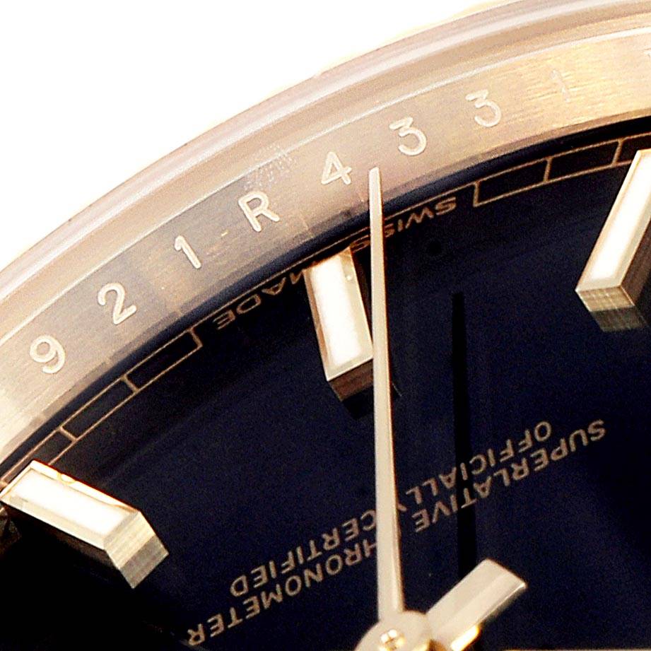 This close-up angle of the Rolex President 228238 Men
s Yellow Gold Black Dial 228238 Men
s Yellow Gold Black Dial watch shows its dial, hands, markers, and part of the chapter ring.