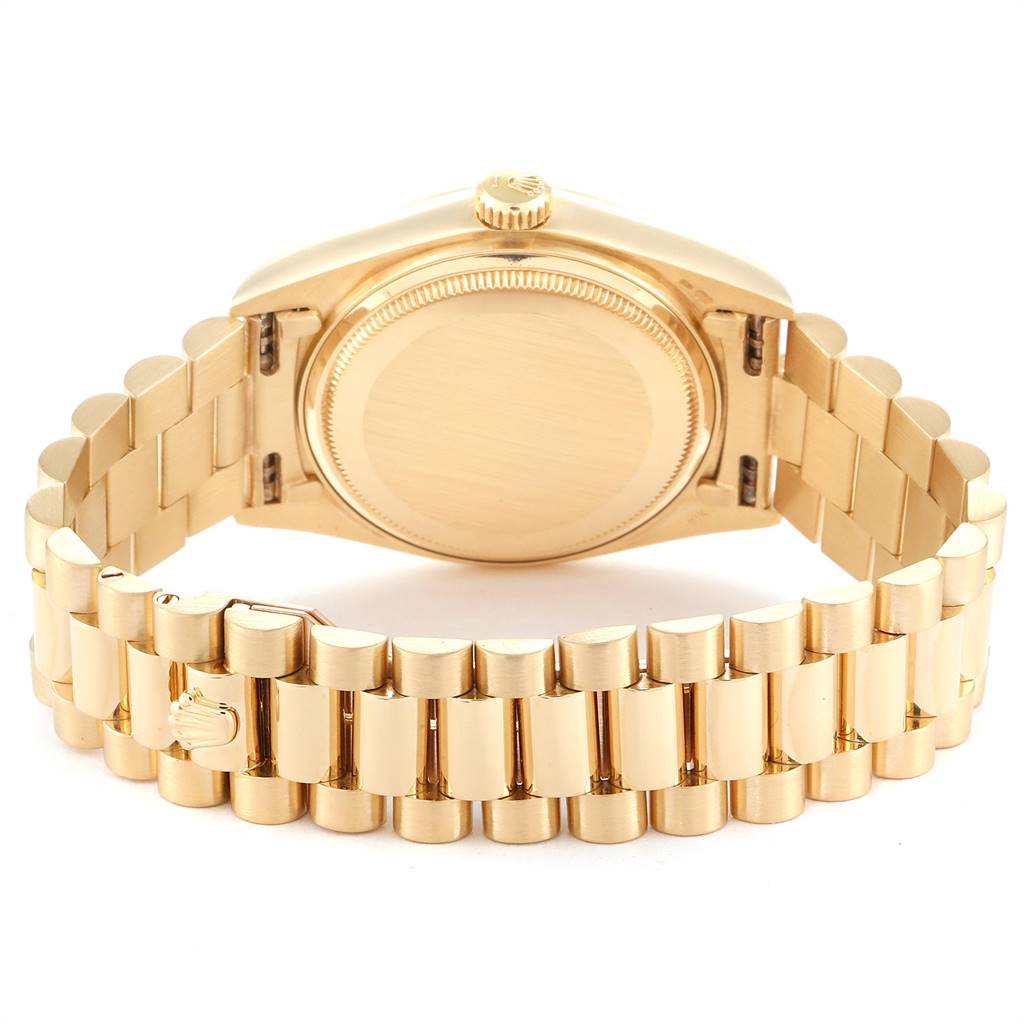The image shows the back and bracelet of a Rolex President 18038 Men's Yellow Gold Champagne Dial 18038 Men's Yellow Gold Champagne Dial model watch, highlighting its gold finish and signature clasp.