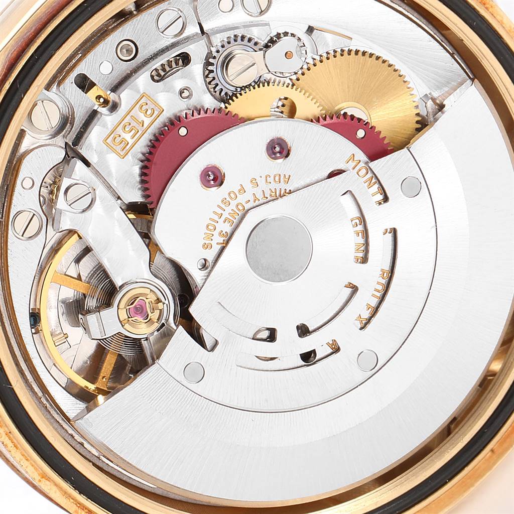 This image shows the intricate internal mechanism of the Rolex President 118238 Men
s Yellow Gold Champagne Dial 118238 Men
s Yellow Gold Champagne Dial model watch from a close-up angle.