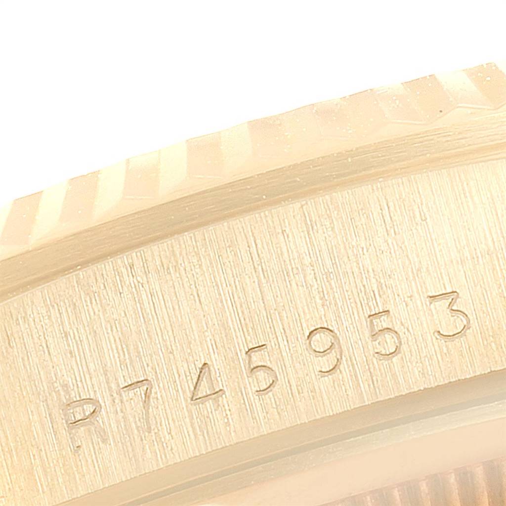 This close-up image shows the serial number on the side of the Rolex President 18238 Men
s Yellow Gold Champagne Dial 18238 Men
s Yellow Gold Champagne Dial model watch.