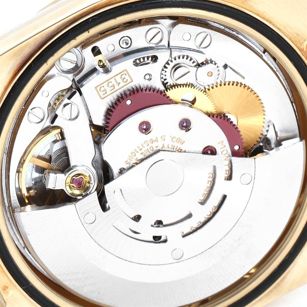 This close-up shows the internal mechanism of the Rolex President 18238 Men
s Yellow Gold Champagne Dial 18238 Men
s Yellow Gold Champagne Dial model watch, highlighting gears and intricate components.