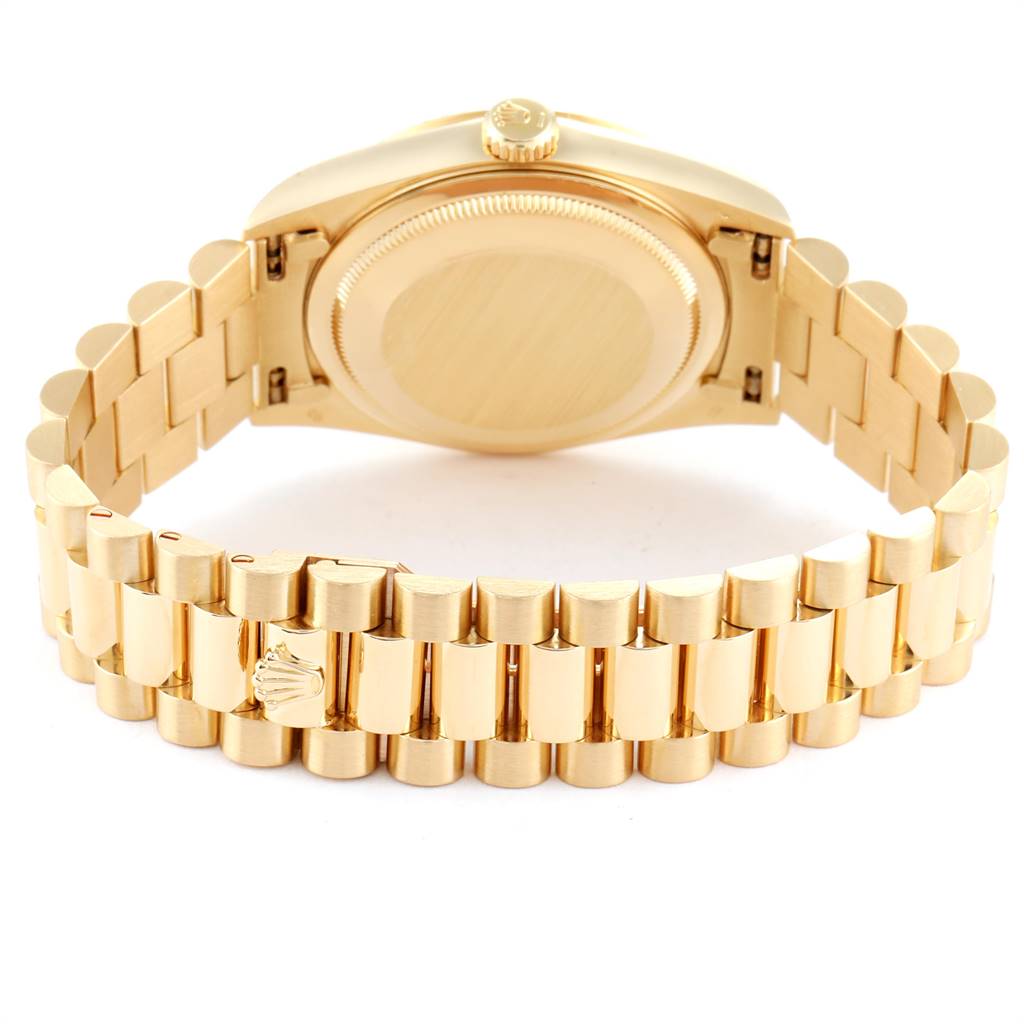 This image shows the back view of a Rolex President 18238 Men
s Yellow Gold Champagne Dial 18238 Men
s Yellow Gold Champagne Dial model, highlighting the gold bracelet and clasp.