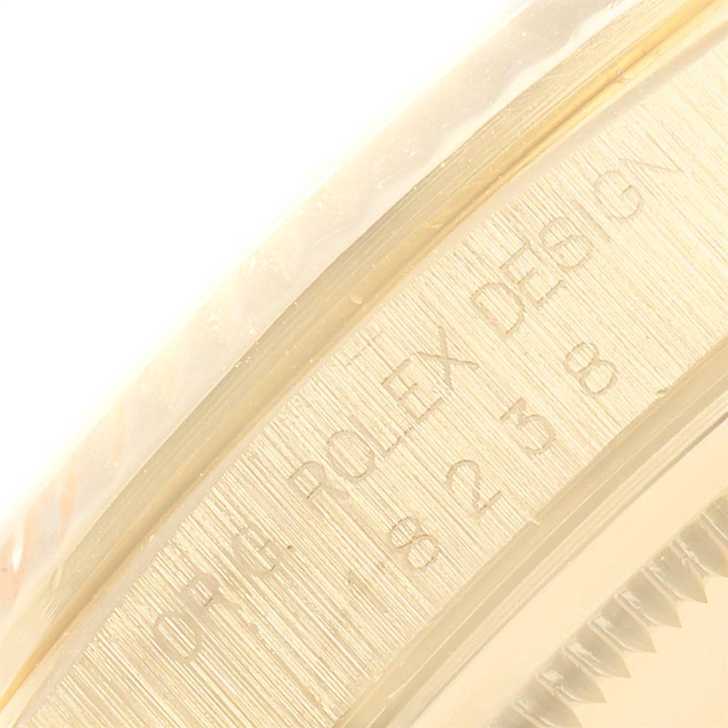 This close-up image shows the engraved case-back edge of a Rolex President 18238 Men
s Yellow Gold Champagne Dial 18238 Men
s Yellow Gold Champagne Dial model watch.