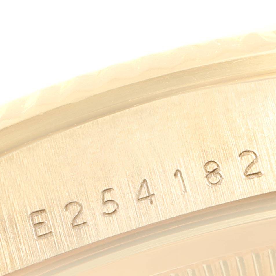 This close-up image shows the engraved serial number on the case back of a Rolex President 18238 Men
s Yellow Gold Champagne Dial 18238 Men
s Yellow Gold Champagne Dial model watch.