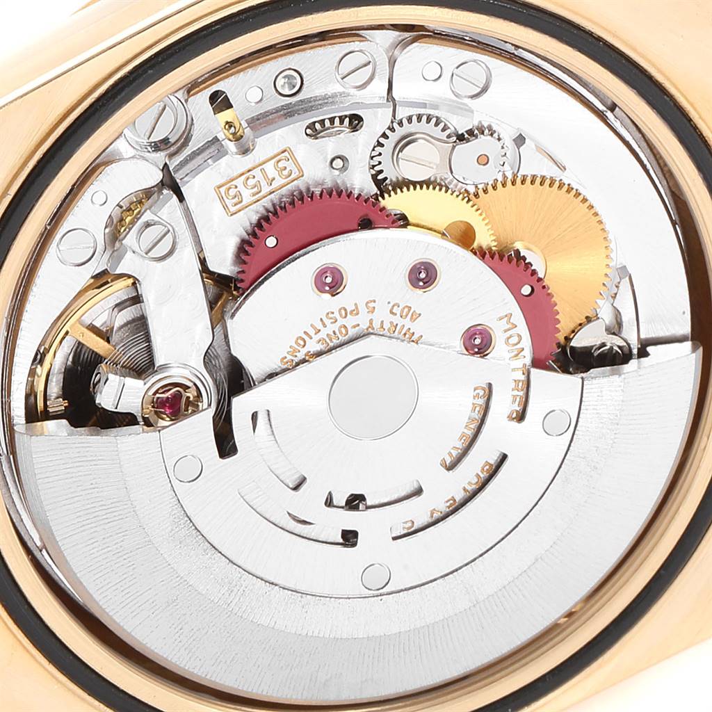 This is a close-up of the movement mechanism of a Rolex President 18238 Men
s Yellow Gold Champagne Dial 18238 Men
s Yellow Gold Champagne Dial model watch, showing gears and inner components.