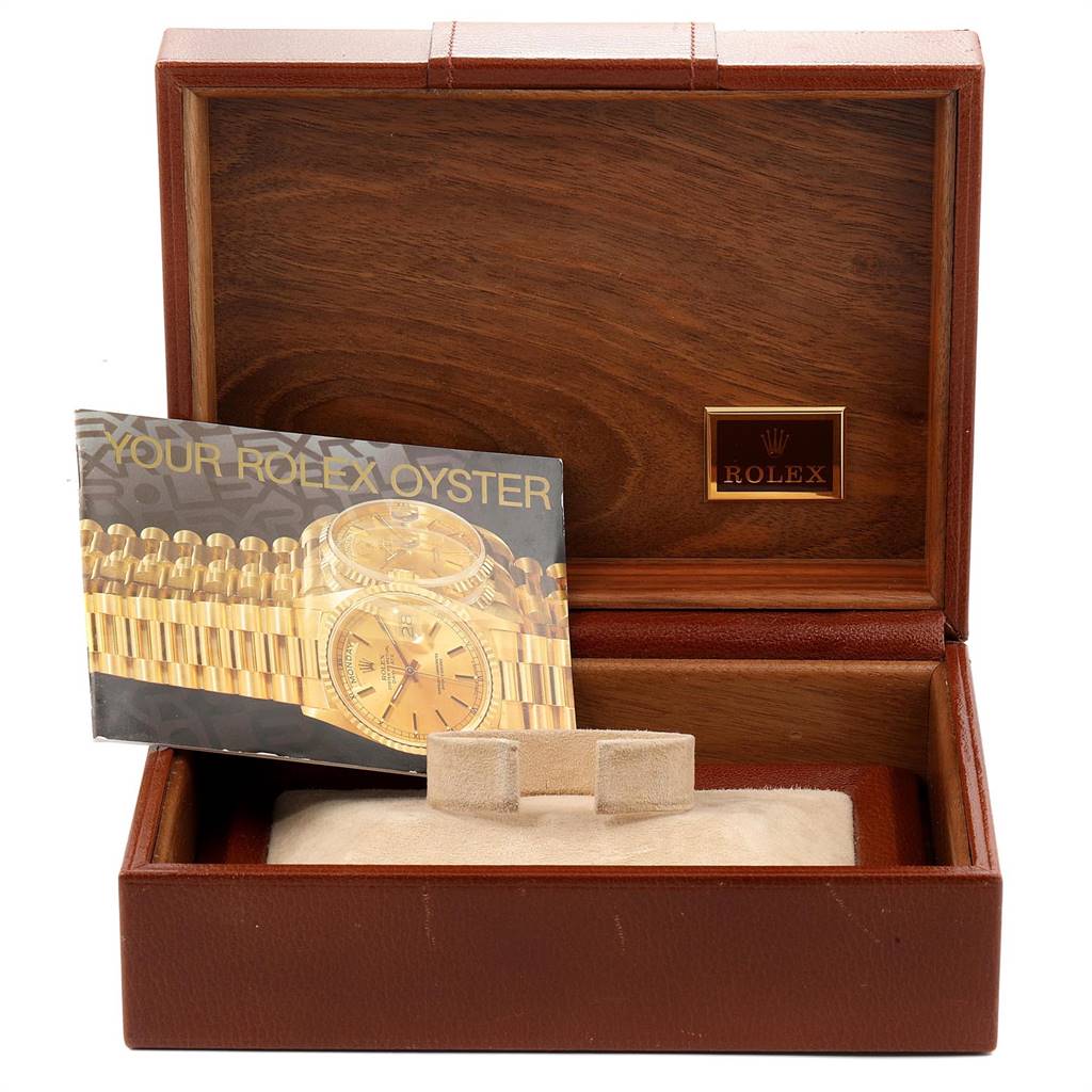 The image shows a Rolex President 18038 Men's Yellow Gold Champagne Dial 18038 Men's Yellow Gold Champagne Dial model watch box with a booklet and a pillow for the watch.