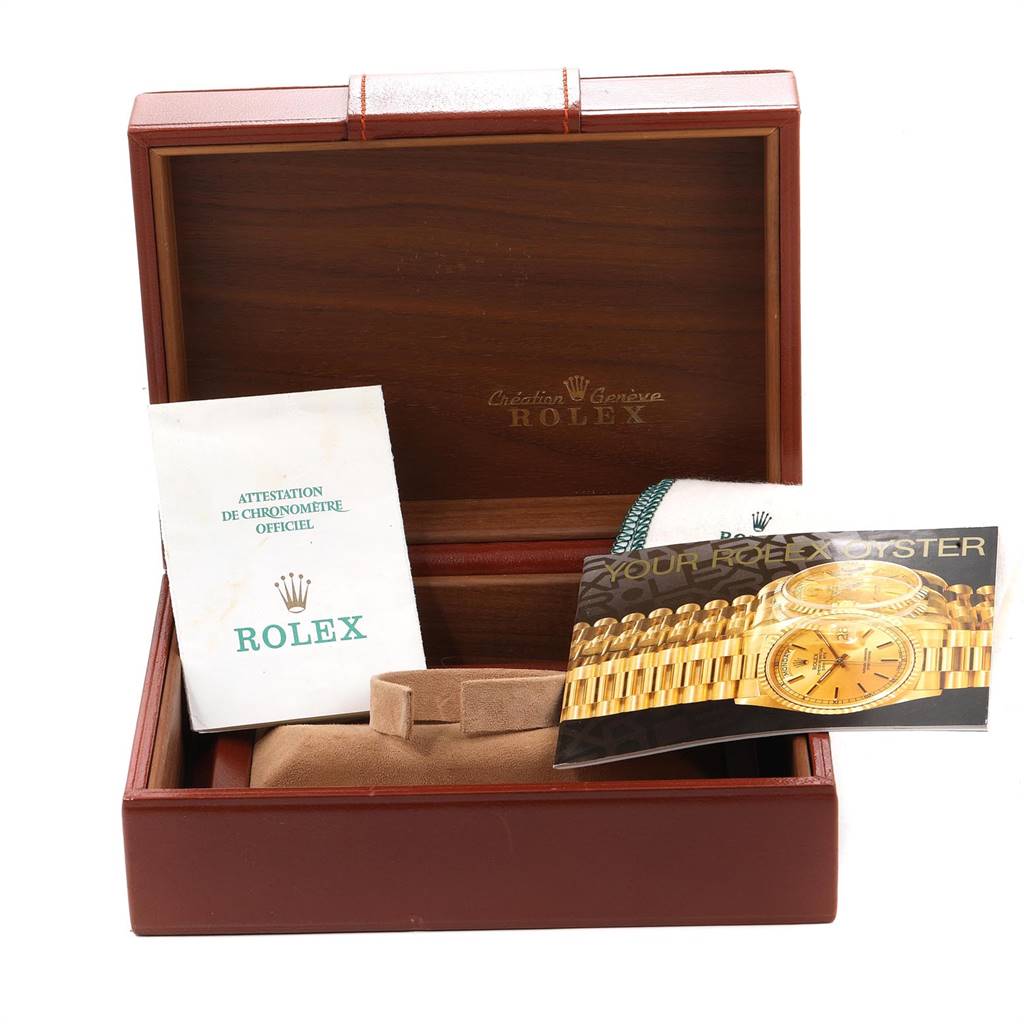 The image shows a Rolex President 16238 Men
s Yellow Gold Champagne Dial 16238 Men
s Yellow Gold Champagne Dial model watch box with official documentation and a booklet, viewed from the front.