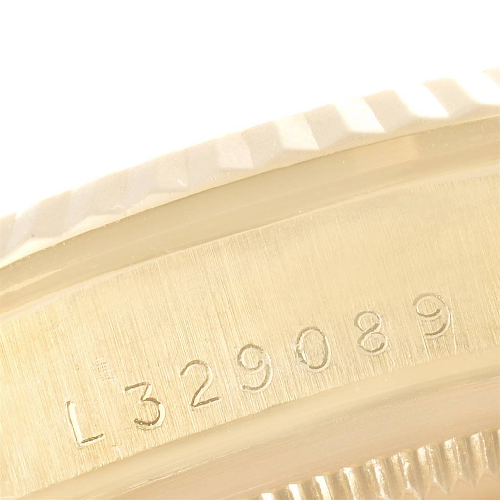 This close-up image of a Rolex President 16238 Men
s Yellow Gold Champagne Dial 16238 Men
s Yellow Gold Champagne Dial model showcases the serial number engraved on the watch case.