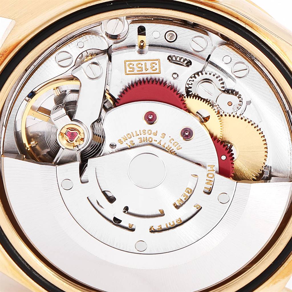 The image shows a close-up of the inner mechanics and gears of a Rolex President 18238 Men
s Yellow Gold Black Dial 18238 Men
s Yellow Gold Black Dial model watch.