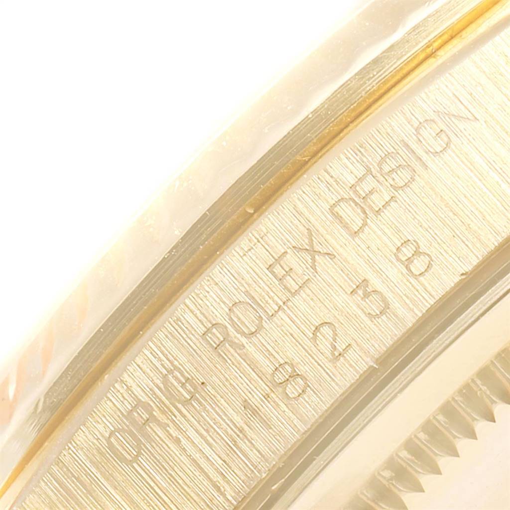 The image shows a close-up of the model number engraved on the case side of a Rolex President 18238 Men
s Yellow Gold Black Dial 18238 Men
s Yellow Gold Black Dial watch.