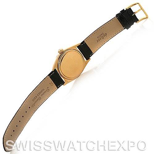 The image shows the back and strap of a Rolex President 1803 Men's Yellow Gold Silver Dial 1803 Men's Yellow Gold Silver Dial model watch, with a black leather band and gold-colored case.