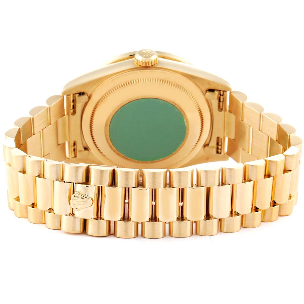 This image shows the back case and part of the bracelet of the Rolex President 18348 Men
s Yellow Gold Champagne Dial 18348 Men
s Yellow Gold Champagne Dial model watch.