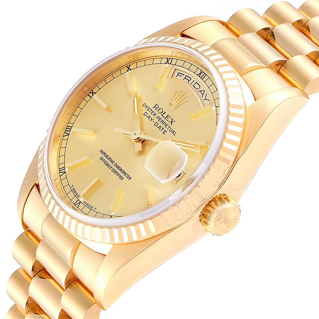 The image shows a close-up, side angle of a gold Rolex President 18238 Men's Yellow Gold Champagne Dial 18238 Men's Yellow Gold Champagne Dial watch, highlighting its dial, day-date display, and part of the bracelet.