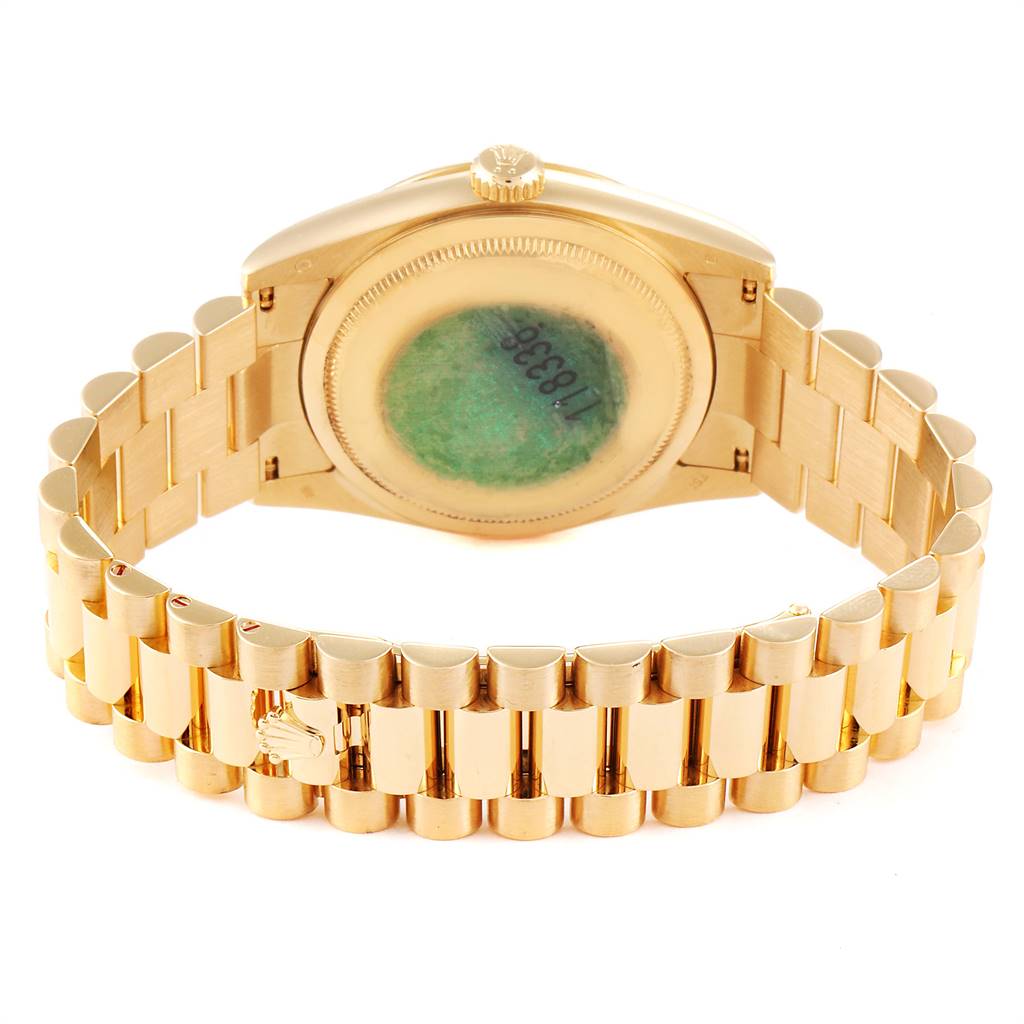 This image shows the back view of the Rolex President 118338 Men's Yellow Gold Champagne Dial 118338 Men's Yellow Gold Champagne Dial model watch, highlighting its case back and gold bracelet.