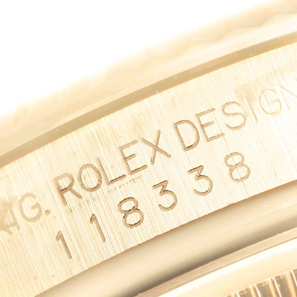 This close-up image shows the engraved serial number on the side of the Rolex President 118338 Men's Yellow Gold Champagne Dial 118338 Men's Yellow Gold Champagne Dial model.