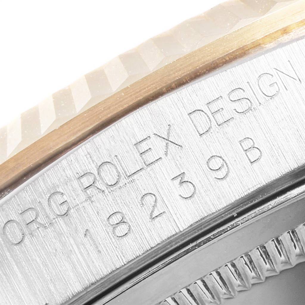 This close-up angle shows the side engraving and fluted bezel of the Rolex President 18239 Men's White Gold Brown Dial 18239 Men's White Gold Brown Dial model watch.