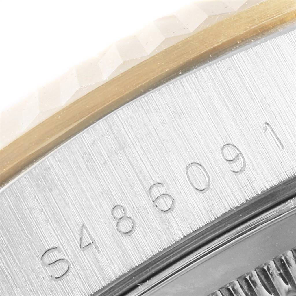The image shows a close-up of the serial number engraved on the side of a Rolex President 18239 Men's White Gold Brown Dial 18239 Men's White Gold Brown Dial model watch.