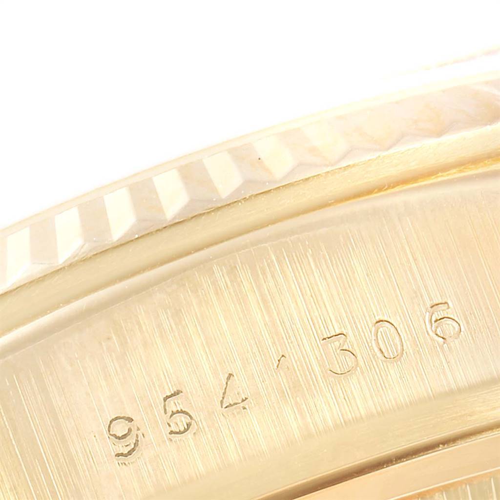 The image shows a close-up of the engraved bezel and case of a Rolex President 18038 Men
s Yellow Gold Champagne Dial 18038 Men
s Yellow Gold Champagne Dial model watch.