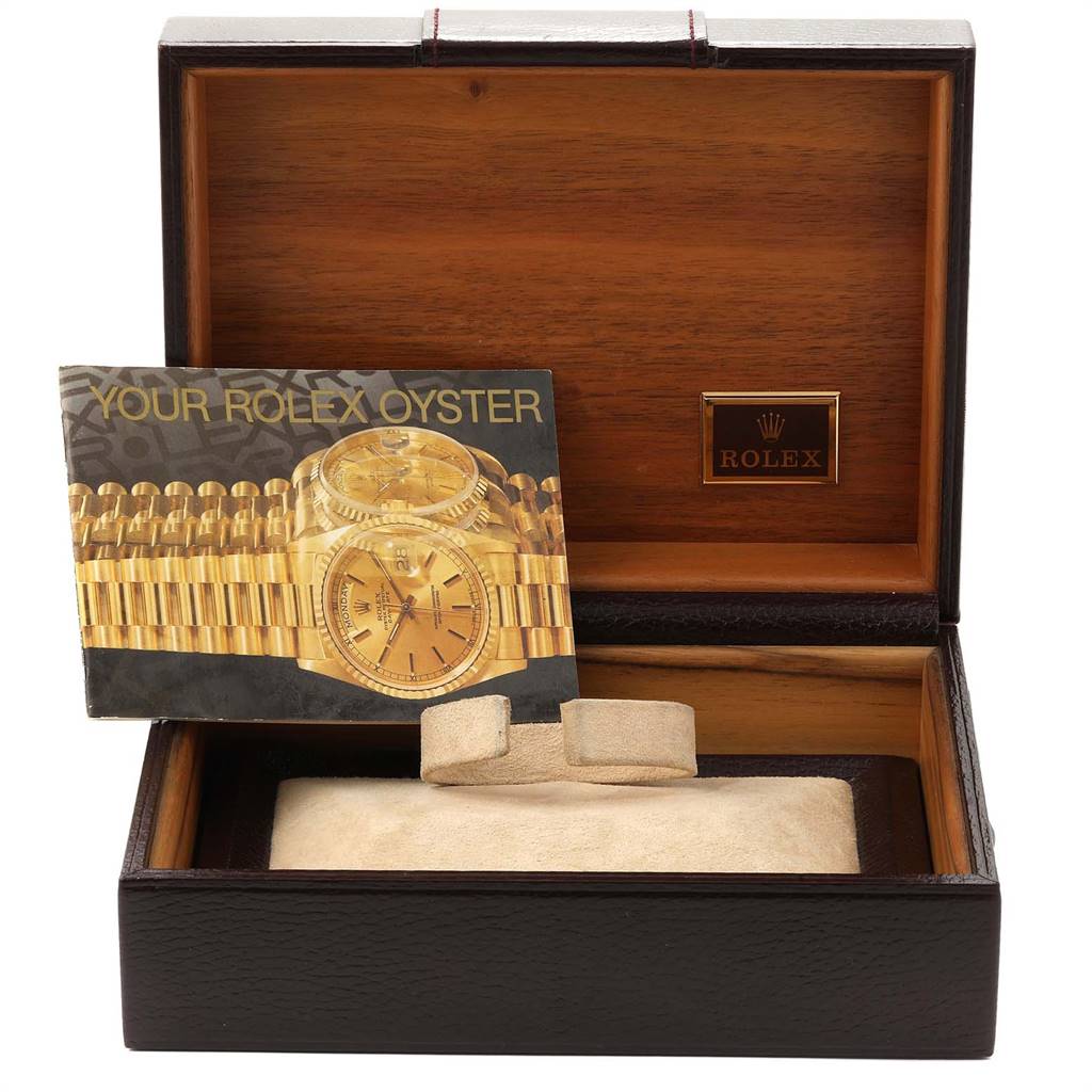 This image shows the packaging and brochure for the Rolex President 18038 Men
s Yellow Gold Champagne Dial 18038 Men
s Yellow Gold Champagne Dial model, with the box lid open displaying its interior.