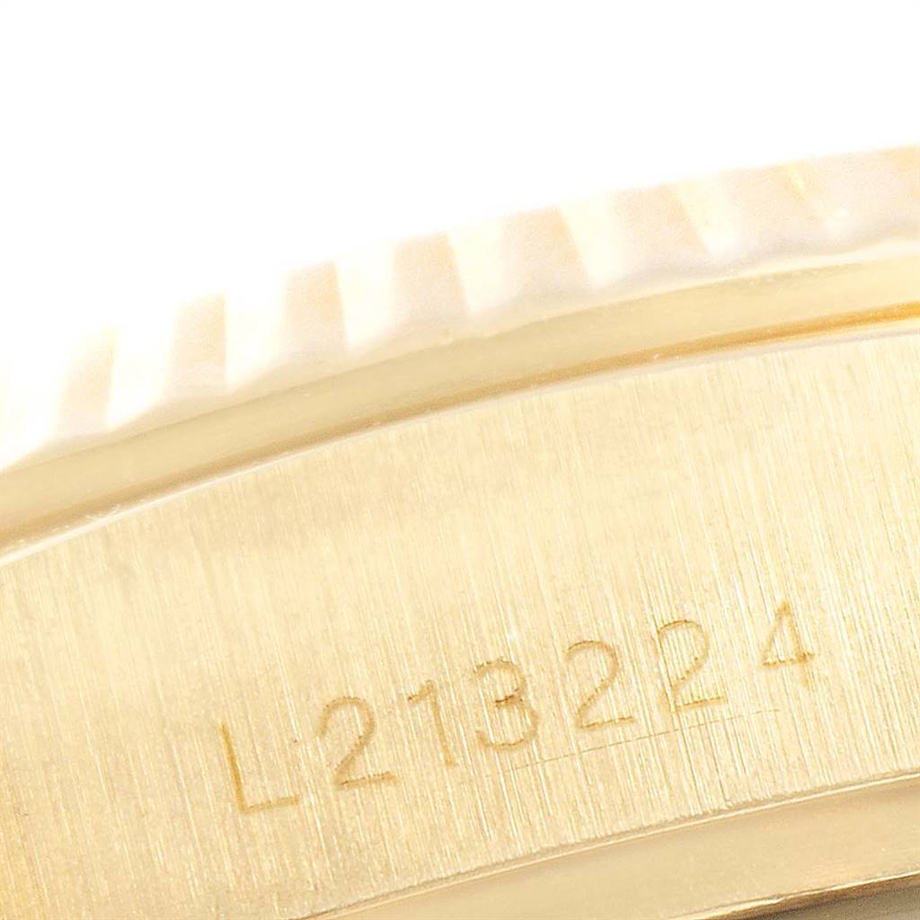 This close-up image shows the serial number engraved on the case of a Rolex President 18038 Men
s Yellow Gold Champagne Dial 18038 Men
s Yellow Gold Champagne Dial model watch.