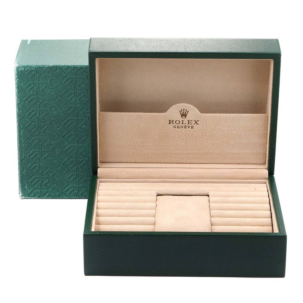 The image shows an open Rolex President 18038 Men
s Yellow Gold Champagne Dial 18038 Men
s Yellow Gold Champagne Dial model watch box, highlighting its green exterior and beige, cushioned interior.