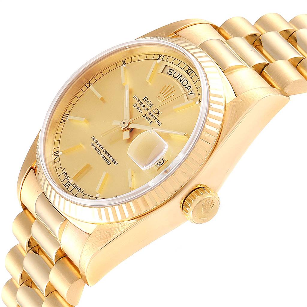 This image shows a Rolex President 18038 Men
s Yellow Gold Champagne Dial 18038 Men
s Yellow Gold Champagne Dial model watch at an angled close-up, highlighting the dial, bezel, crown, and part of the bracelet.