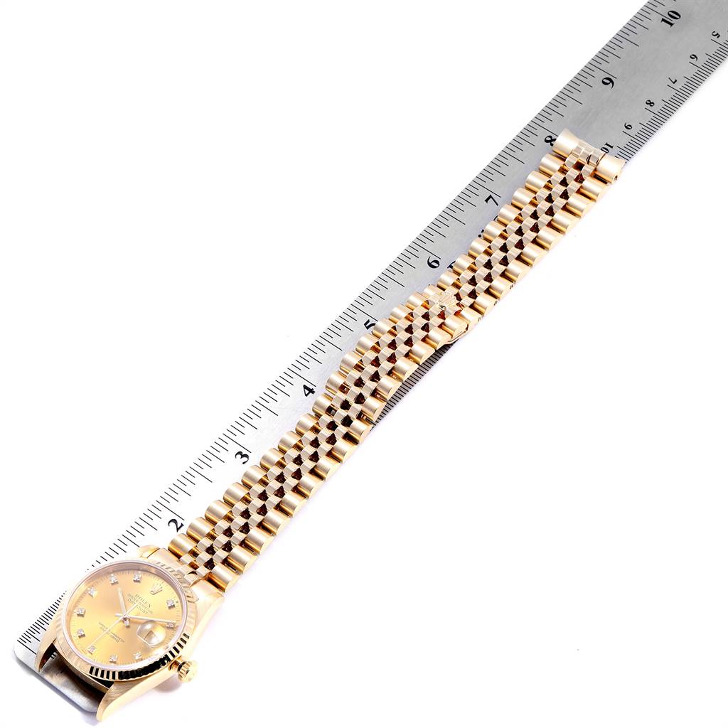 The image shows the Rolex President 16238 Men
s Yellow Gold Champagne Dial 16238 Men
s Yellow Gold Champagne Dial model watch laid flat, with the watch dial and bracelet fully visible, beside a ruler.