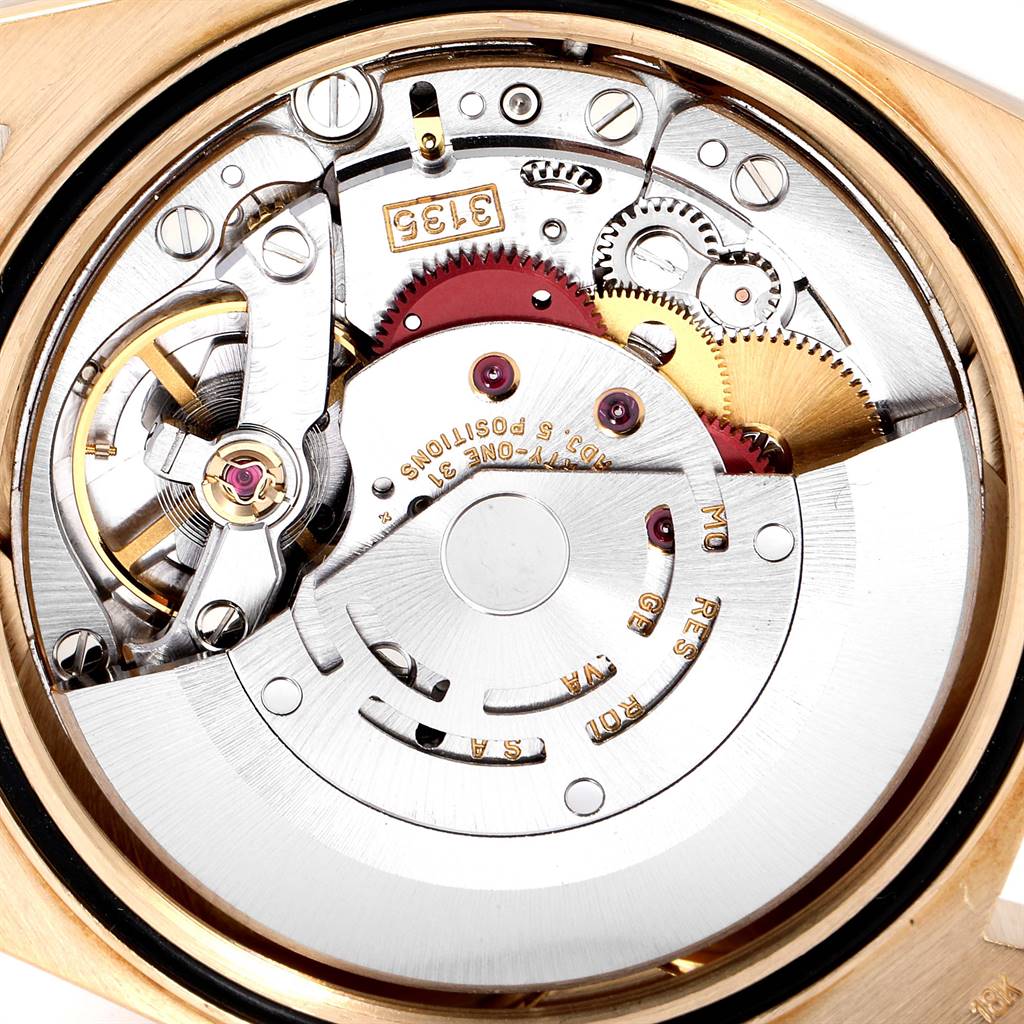 The image shows the intricate internal mechanism of the Rolex President 16238 Men
s Yellow Gold Champagne Dial 16238 Men
s Yellow Gold Champagne Dial model watch from a close-up angle.
