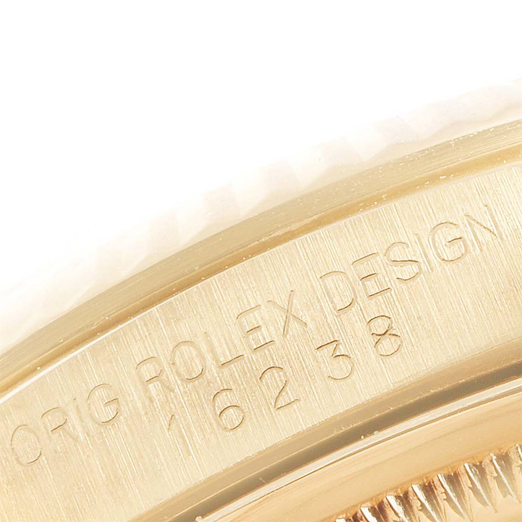 The image shows a close-up of the side with an engraved serial number on the bezel of a Rolex President 16238 Men
s Yellow Gold Champagne Dial 16238 Men
s Yellow Gold Champagne Dial model watch.